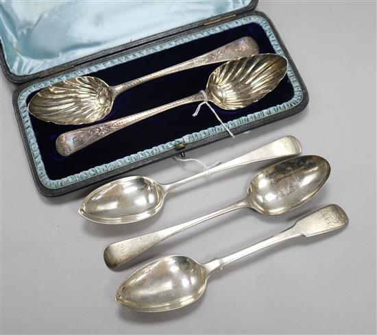A pair of George III silver serving spoons, cased and three tablespoons, approx 10.5oz gross